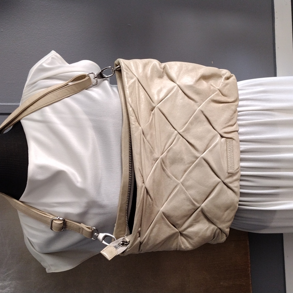Adjustable strap cream purse